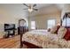 Bedroom with hardwood floors, ceiling fan and large windows providing natural light at 60 Streamside Dr, Covington, GA 30016