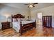 Main bedroom with hardwood floors, a ceiling fan, and a dresser at 60 Streamside Dr, Covington, GA 30016
