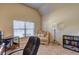 Study featuring a corner desk, cozy chair and a ring light near the window at 60 Streamside Dr, Covington, GA 30016