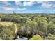 Landscape view reveals a distant water tower and a vast expanse of lush trees at 9258 Westview Sw Dr, Covington, GA 30014