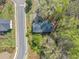 Drone shot displays the house and a shed on a corner lot with surrounding landscaping and neighboring homes at 9258 Westview Sw Dr, Covington, GA 30014