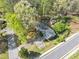 Overhead view of the home, revealing its layout, surrounding trees, and shed in the backyard at 9258 Westview Sw Dr, Covington, GA 30014