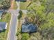 Overhead view of the house with a driveway, situated on a corner lot surrounded by mature trees at 9258 Westview Sw Dr, Covington, GA 30014