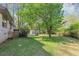 Expansive backyard featuring a storage shed and mature trees, offering privacy and space at 9258 Westview Sw Dr, Covington, GA 30014