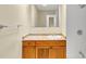 Bright bathroom features tiled shower, vanity with storage, and a decorative towel rack at 9258 Westview Sw Dr, Covington, GA 30014