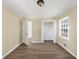 This bedroom features neutral walls, updated floors, and a bright window with a view of the outdoors at 9258 Westview Sw Dr, Covington, GA 30014