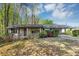 Charming brick ranch-style home with a carport and well-maintained landscaping at 9258 Westview Sw Dr, Covington, GA 30014