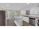 Updated kitchen featuring stainless steel appliances, a center island, and white cabinetry at 9258 Westview Sw Dr, Covington, GA 30014