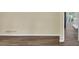 Clean living room featuring updated flooring, baseboard and neutral paint at 9258 Westview Sw Dr, Covington, GA 30014