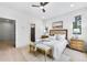 Comfortable bedroom featuring hardwood floors, neutral decor, and ample natural light at 1171 State St # B, Atlanta, GA 30318