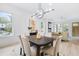 Bright dining area featuring modern lighting, hardwood floors, and an open view to the living room at 1171 State St # B, Atlanta, GA 30318