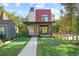 Striking modern two-story home with a covered porch, brick accents, and lush green lawn at 1171 State St # B, Atlanta, GA 30318