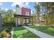 Contemporary two-story home featuring a covered porch, brick accents, and a manicured front yard at 1171 State St # B, Atlanta, GA 30318