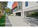 Modern home with a concrete driveway leading up to a large garage at 1171 State St # B, Atlanta, GA 30318
