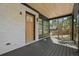 Charming covered front porch with a wood door, stylish railings, and a cozy, inviting entrance at 1171 State St # B, Atlanta, GA 30318