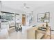 Sun-lit living room with stylish décor, light wood floors, and expansive windows overlooking the outdoors at 1171 State St # B, Atlanta, GA 30318