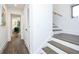 Bright hallway with wood floors that leads to the staircase and living room of the home at 224 Ormond Sw St # A, Atlanta, GA 30315