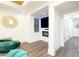 Modern living room with white walls, wood floors, an electric fireplace, and an entertainment area at 224 Ormond Sw St # A, Atlanta, GA 30315