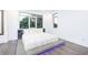 Spacious main bedroom featuring modern finishes, large windows, and hardwood floors at 224 Ormond Sw St # A, Atlanta, GA 30315