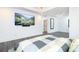 Large main bedroom with hardwood floors, a ceiling fan, and a wall-mounted television at 224 Ormond Sw St # A, Atlanta, GA 30315