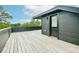 Spacious roof deck with wood flooring and sleek black exterior siding at 224 Ormond Sw St # A, Atlanta, GA 30315