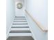 Bright staircase with hardwood treads, white risers, and a matching handrail at 224 Ormond Sw St # A, Atlanta, GA 30315