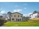 Home exterior features a spacious backyard with ample green space at 2312 Herring Sw Rd, Atlanta, GA 30311