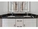 Bright bathroom features double sink vanity with striking countertop and modern lighting at 2312 Herring Sw Rd, Atlanta, GA 30311