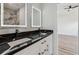 Bright bathroom features double sink vanity with stunning countertop and modern lighting at 2312 Herring Sw Rd, Atlanta, GA 30311