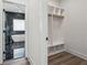 Walk-in closet leads to bath with luxurious tub and black tiled shower at 2312 Herring Sw Rd, Atlanta, GA 30311