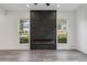 Sleek fireplace feature with tile surround and modern design, flanked by bright windows at 2312 Herring Sw Rd, Atlanta, GA 30311
