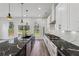 Modern kitchen with granite countertops, stainless steel appliances, and ample cabinet space at 2312 Herring Sw Rd, Atlanta, GA 30311