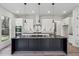 Modern island kitchen featuring an island with marble countertop and stainless appliances at 2312 Herring Sw Rd, Atlanta, GA 30311