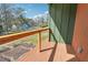 Cozy porch featuring wood floors and railing with a view of the yard and neighborhood at 2312 Herring Sw Rd, Atlanta, GA 30311