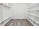 Spacious walk-in closet with custom shelving and ample storage, perfect for organization and convenience at 2312 Herring Sw Rd, Atlanta, GA 30311