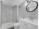 Updated bathroom with a new vanity, toilet, and shower with modern tiling at 4564 Cypress Ridge Ct, Stone Mountain, GA 30083