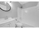 Clean, well-lit bathroom featuring a vanity, mirror, and shower-tub combo at 4564 Cypress Ridge Ct, Stone Mountain, GA 30083