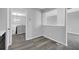 Cozy dining area with wood flooring and a view to the living room and kitchen at 4564 Cypress Ridge Ct, Stone Mountain, GA 30083