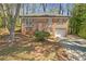 Charming brick home featuring a well-manicured lawn and an attached garage at 4564 Cypress Ridge Ct, Stone Mountain, GA 30083