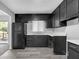 Functional kitchen featuring dark cabinets, white countertops, and updated flooring at 4564 Cypress Ridge Ct, Stone Mountain, GA 30083
