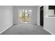 Bright living space with sliding glass doors leading to a deck and a view to the kitchen at 4564 Cypress Ridge Ct, Stone Mountain, GA 30083