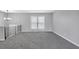 Spacious living area featuring a large window, new carpeting, and neutral paint at 4564 Cypress Ridge Ct, Stone Mountain, GA 30083