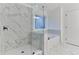 Stunning bathroom with a frameless glass shower and a soaking tub with marble accents for a spa-like feel at 656 Avondale Park Cir, Decatur, GA 30032