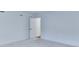 Bright bedroom features neutral walls, plush carpeting, and a door leading to the closet at 656 Avondale Park Cir, Decatur, GA 30032