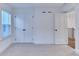 Bedroom with ample lighting from the windows and closet with bi-fold doors at 656 Avondale Park Cir, Decatur, GA 30032
