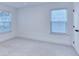 Carpeted bedroom has two windows providing ample natural light at 656 Avondale Park Cir, Decatur, GA 30032