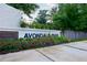 Welcoming entrance sign to Avondale Park with colorful flower beds and lush greenery at 656 Avondale Park Cir, Decatur, GA 30032