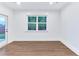 Bright dining room with hardwood floors and a large window at 656 Avondale Park Cir, Decatur, GA 30032