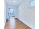 Bright foyer featuring luxury vinyl plank flooring, fresh white paint, and ample natural light at 656 Avondale Park Cir, Decatur, GA 30032