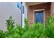 Inviting front entrance with brick facade, gray door, and manicured landscaping at 656 Avondale Park Cir, Decatur, GA 30032